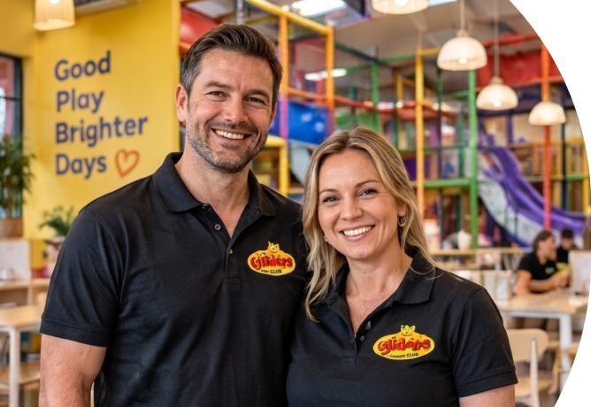 Lollipop's franchise owners smiling inside a colourful indoor play centre